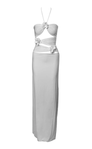 Close-up of white halter maxi dress with cut-out details and 3D floral appliqués