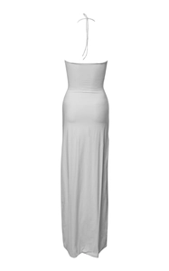 Detail of white backless halter dress featuring lace-up tie and slim fit silhouette