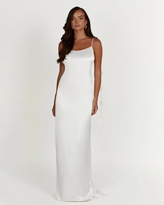 Detail of white satin maxi dress featuring elegant thin straps and glossy texture