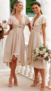 Detail of champagne satin dress with waist cut-out, V-neck, and elegant ruffle sleeves