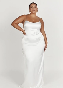 Detailed close-up of white satin maxi dress featuring elegant 3D floral accent on the back