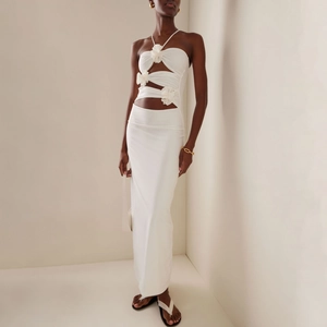Slim fit white halter neck maxi dress with cut-outs and 3D floral decorations