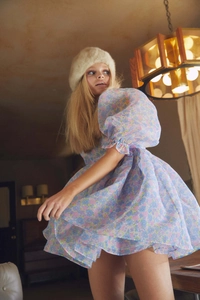 Detail of floral puff sleeves and layered mesh tulle on a vintage princess dress