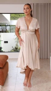 Detail of champagne satin V-neck dress with knot front and ruffled short sleeves
