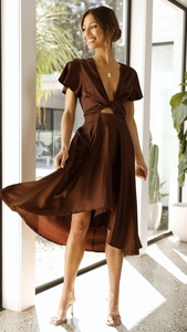 Detail of dark brown satin dress with waist cut-out and high-low asymmetrical hem
