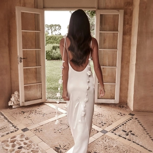 Elegant white satin backless maxi dress with 3D floral ties and delicate straps