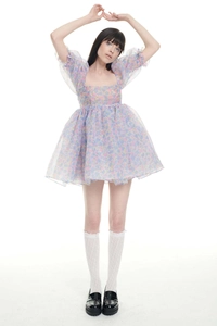 Detail of floral puff sleeve dress with mesh layers and vintage palace style print