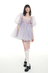 Close-up of vintage puff sleeve floral organza dress with square neckline detail