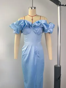 Detailed close-up of light blue satin off-shoulder dress with elegant ruffles and draping