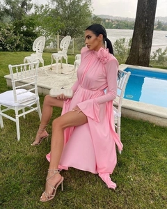 Detail of pink long-sleeved dress featuring elegant 3D floral accent on the shoulder