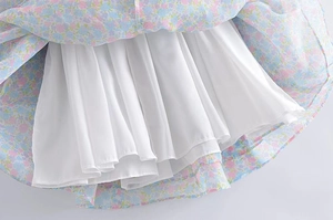 Detail view of floral vintage dress hem showing the soft lining and quality stitching