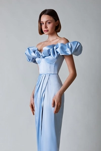 Detailed view of light blue satin evening gown with tiered ruffle neckline and waist pleats
