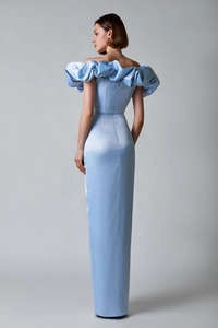 Detail view of the light blue satin dress showing off-shoulder ruffles and back zipper