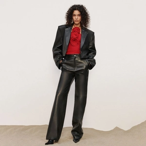 Three-piece leather outfit with black blazer, high-waist pants and red floral halter top