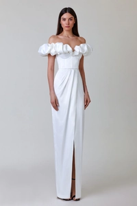 Macro detail of white satin evening dress with voluminous ruffled sleeves and smooth texture