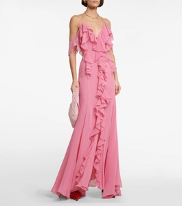 Detail of pink chiffon long dress showing layered ruffles and delicate spaghetti straps