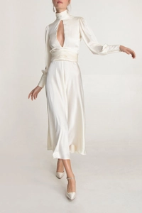 Detail of elegant satin dress showing keyhole neckline and ruched waistline texture