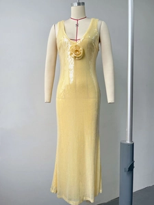 Detail view of yellow sequin evening gown featuring handmade floral 3D appliqués