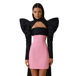 Elegant two-piece dress set featuring black puff sleeves top and pink high waist mini skirt