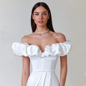 Elegant white off-shoulder evening dress with ruffled neckline and silk satin finish
