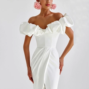 Elegant off-shoulder white evening gown with ruffled neckline and high slit detail