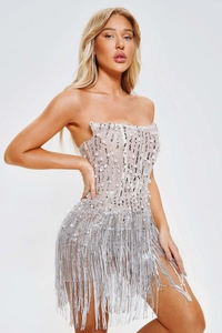 Close-up of bustier dress detail with hand-stitched pearls, sequins and fringe hem