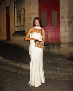Detail of elegant white strapless fisheye dress with matching scarf and texture