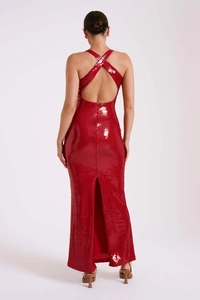 Detailed back view of a red sequin evening dress with criss-cross back and high slit detail