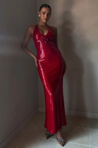 Detail of red sequin evening dress with handmade 3D floral accent on the neckline
