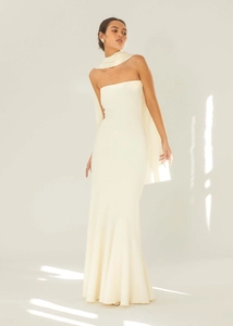 Detail of elegant cream-colored off-shoulder mermaid dress with matching neck scarf accessory