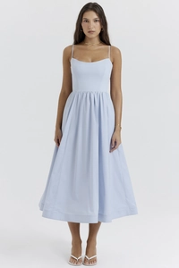 Detail of light blue A-line dress with slim bodice and elegant pleated flowy skirt
