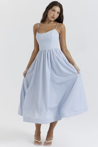 Detail view of sky blue midi dress featuring spaghetti straps and pleated waist design