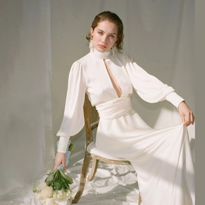 Elegant white satin maxi dress with puff sleeves, high neck, and hollow out chest detail