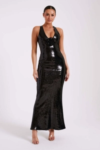 Close-up of black sequined evening gown featuring a halter neck and 3D floral detail