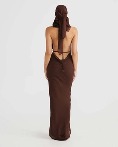 Detail of elegant backless long dress with cross tie straps and matching headscarf