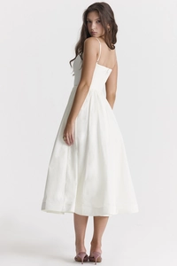 Elegant white backless midi dress with pleated waist and A-line silhouette details