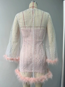 Detail of pink party dress showing silver sequins and ostrich feather trim on sleeves