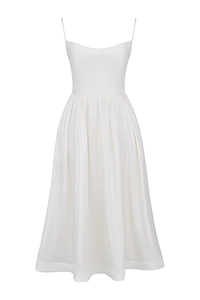 Detail of white midi dress showing thin straps and elastic pleated waistline design