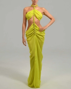 Detail of lime green chiffon evening gown showing the halter neck and beaded center trim