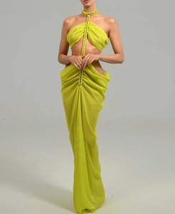 Detail of beaded sequin neckline on a lime green chiffon halter dress with cut-outs