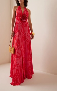 Close-up of elegant 3D floral waist detail on red halter neck long dress with patterns