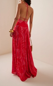 Detail of red floral halter maxi dress with delicate back tie design and flowy skirt