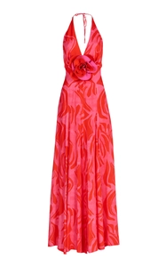 Detail of elegant V-neck maxi dress with pink floral print and large 3D rosette decoration