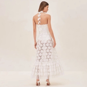 Elegant white lace halter neck maxi dress with floral embroidery and ruffle hemline