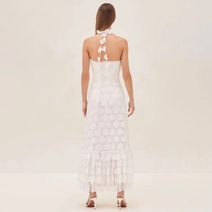 White halter neck lace maxi dress with 3D floral accents and tiered ruffle hemline