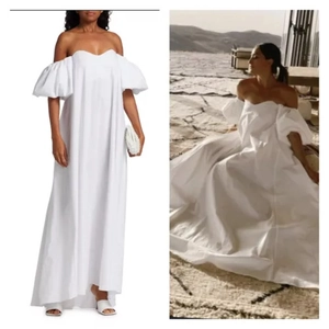 Robe longue blanche chic avec manches bouffantes et silhouette trapèze élégante