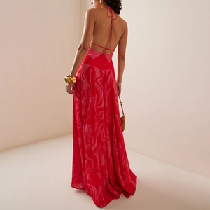 Elegant backless halter dress with red abstract pattern and crisscross back straps