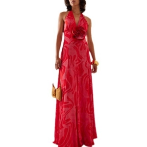 Elegant red halter neck maxi dress with 3D floral accent and abstract vortex pattern
