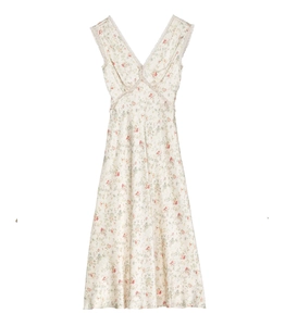 Detailed view of floral French style dress with delicate lace trim and V-neckline finish