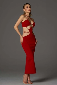 Detail of red hollowed-out bandage dress featuring metal ring buckles and cutout design